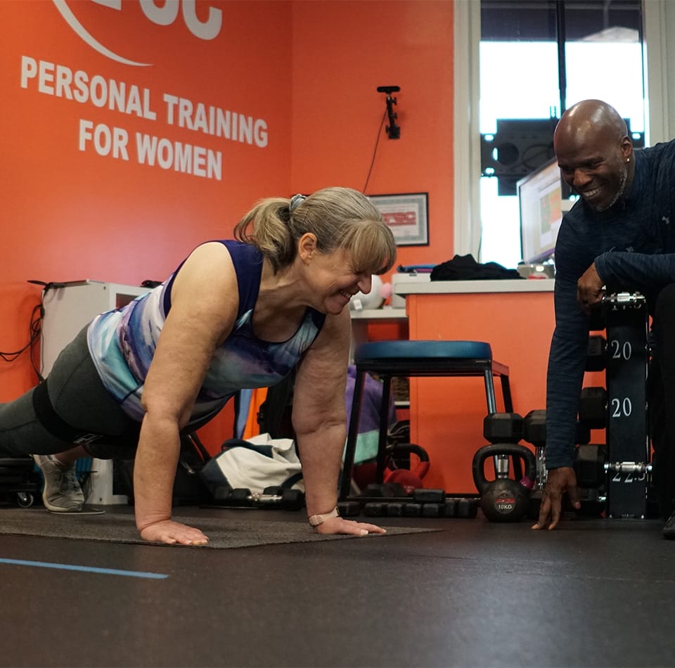 woman exercising with her personal trainer at True 180 Personal Training For Women