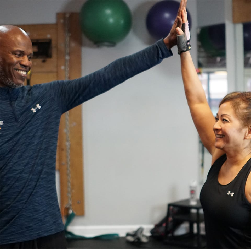 woman smiling while training at True 180 Personal Training For Women